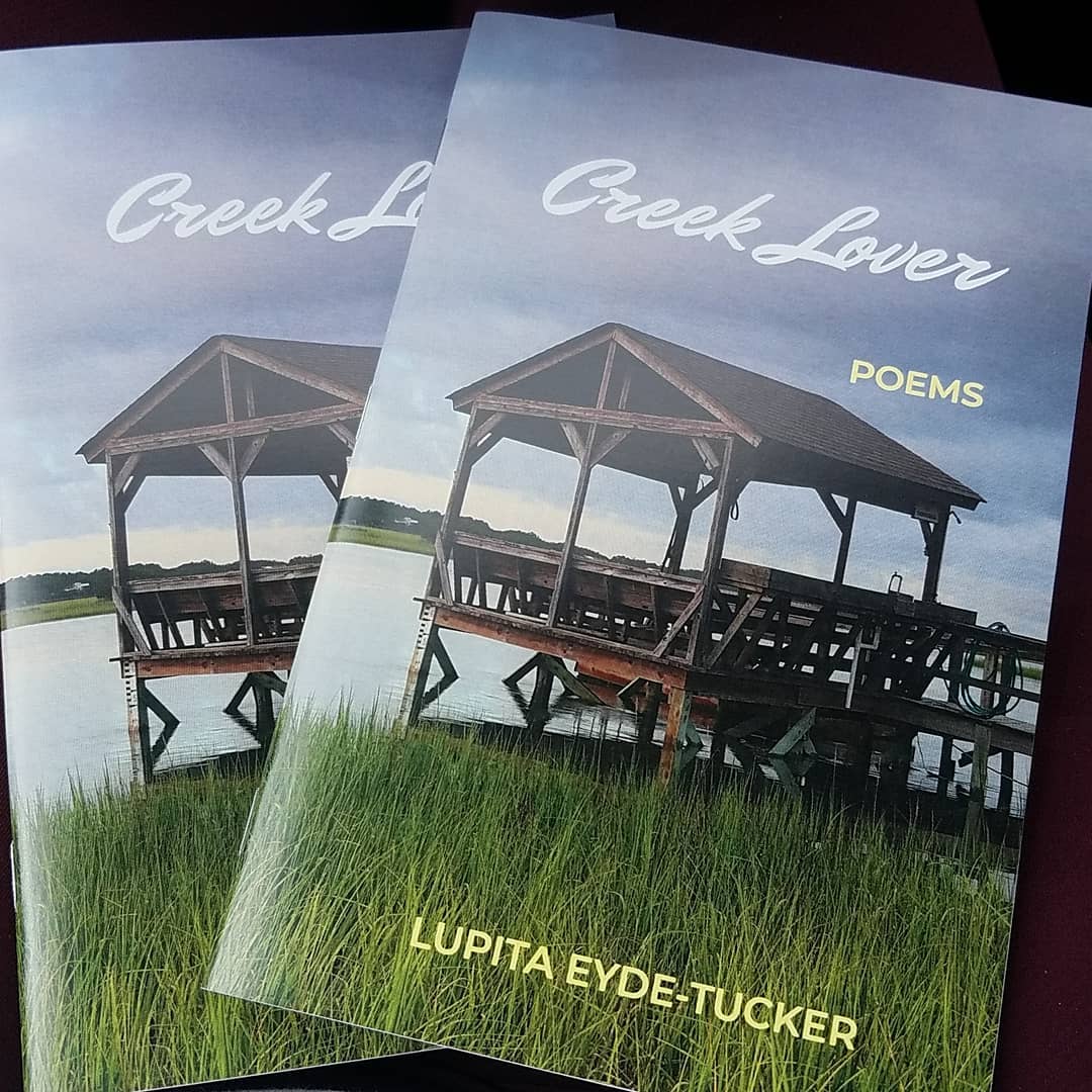 Cover image of Creek Lover, chapbook. Image includes two copies of the book, with a picture of a creek dock and the marsh on the cover.